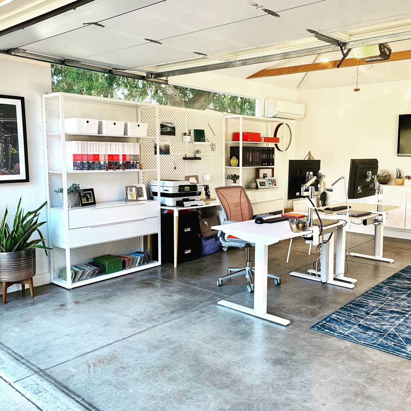 office garage conversion concrete floor white office tables